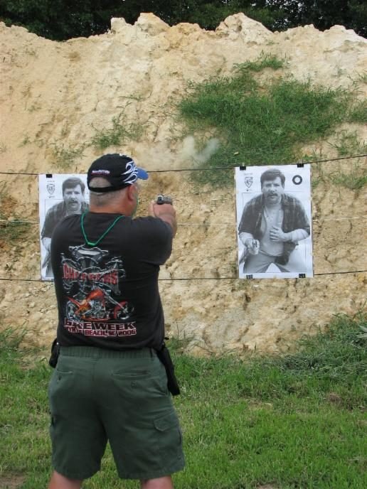 Concealed handgun class student firing center-of-mass shots on a B-27 target