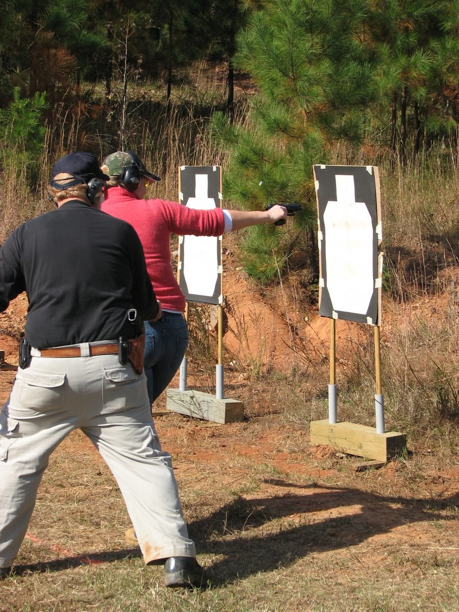 Instructor Chris Raper staying close as a student shoots on the move at three yards