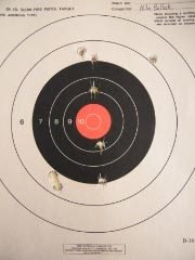 Student's first ten-shot target at seven yards before instruction
